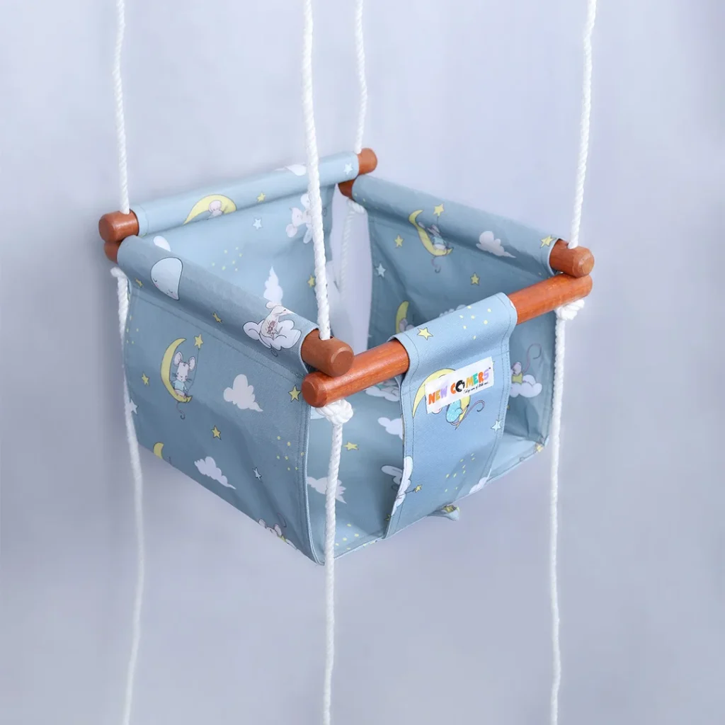 blue fabric with cartoon print jhula, Discover our baby swing cartoon range, designed to delight your little one, merging playful vibes with utmost comfort for nap times.