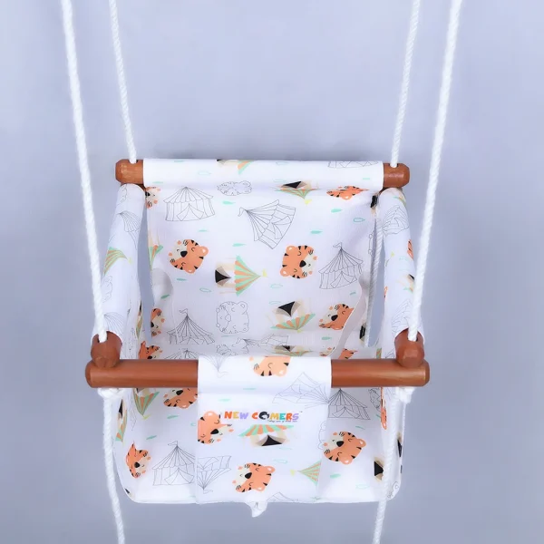 baby swing with white colored , baby tiger printed on cotton garment. Portable Small beby jhula with polished wooden frames and ropes