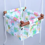 elephant shape in polka dot and line patterned prints in red, yellow, green color adjustable baby swing