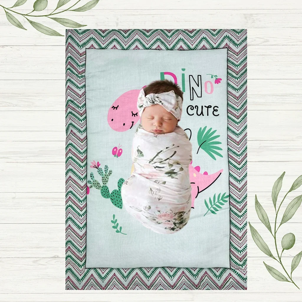 warm colored fabric with cute pink butterfly dinosaur cartoon print newborn mat with baby sleeping peacefully on it filled with cozy materials made by newcomers.