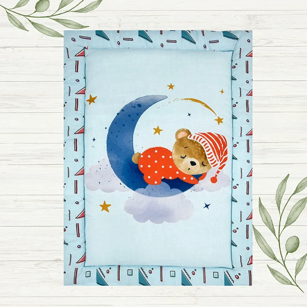 a baby bear sleeping on moon in a dreamy night cartoon print blue color fabric newborn activity mat by newcomers