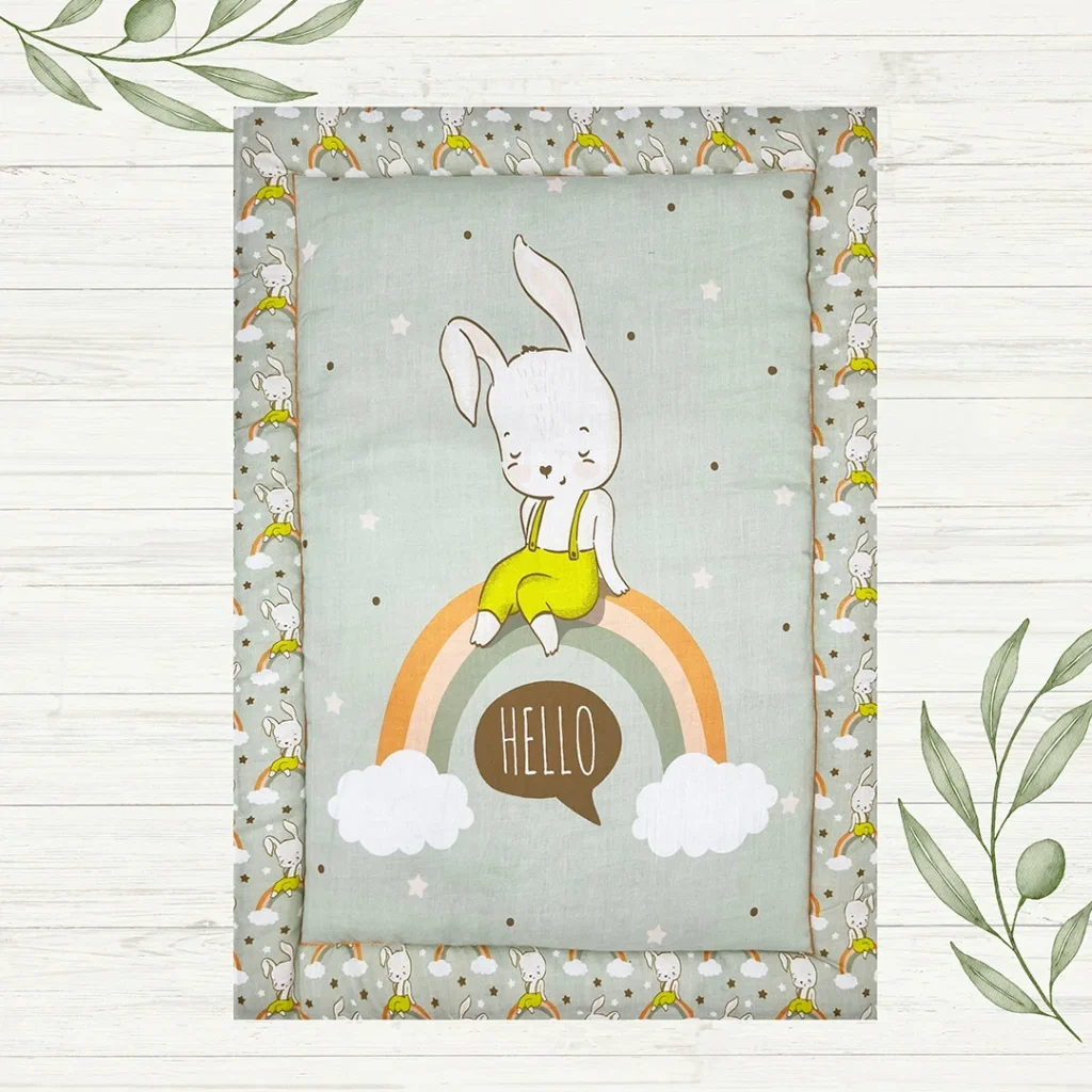 female rabbit in jumpsuit sitting on a rainbow saying "Hello" cartoon print kindergarten floor mat made by newcomers