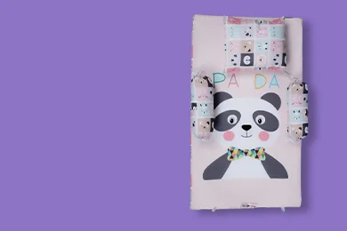 Peach fabric panda with bow tie cartoon print bedding cot set. Nursery cot bedding set comes with bed mattress, a pillow and bolster made by newcomers