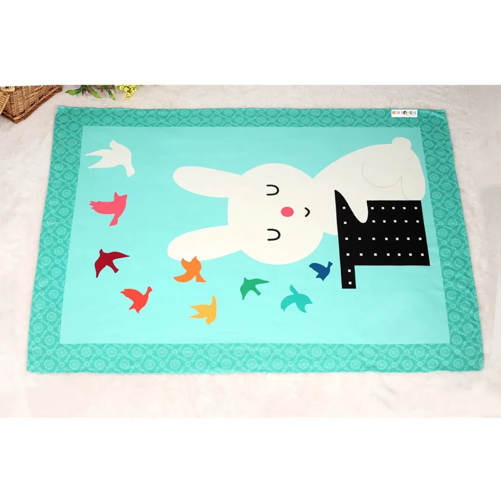 Sea green warm crib fleece blanket with magician rabbit doing magic nursery print blanket for photoshoot by newcomers