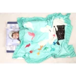 Sea green warm crib fleece blanket with magician rabbit doing magic nursery print and baby sleeping inside blanket for photoshoot by newcomers