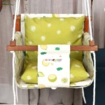 Off white fabric with fruit prints baby swing with light 2 pcs of parrot green pillows for back and sitting