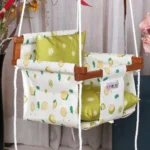 Off white fabric with fruit prints baby swing with light 2 pcs of parrot green pillows for back and sitting