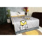 light grey and yellow print comforter duvet on bed with prisoner minions plotting escape from prison print on it by new comers