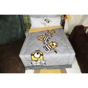 light grey and yellow print comforter duvet on bed with prisoner minions plotting escape from prison print on it by new comers