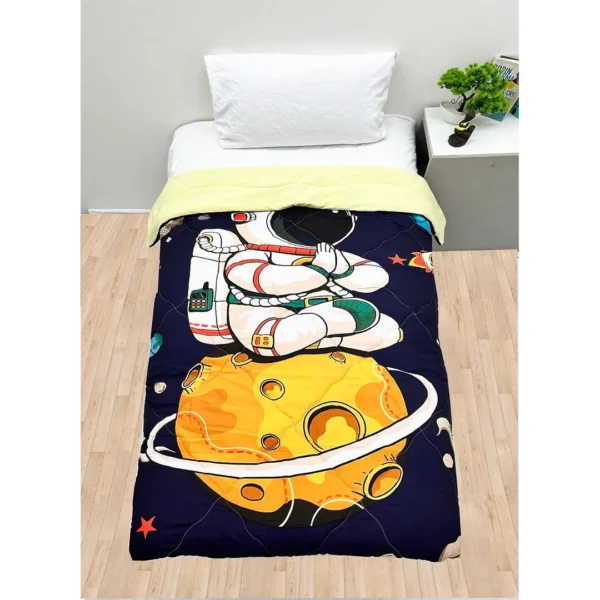 A Sky And Planet Nursery Print Reversible Kids Comforters set with an astronaut and a moon on it by Newcomers.