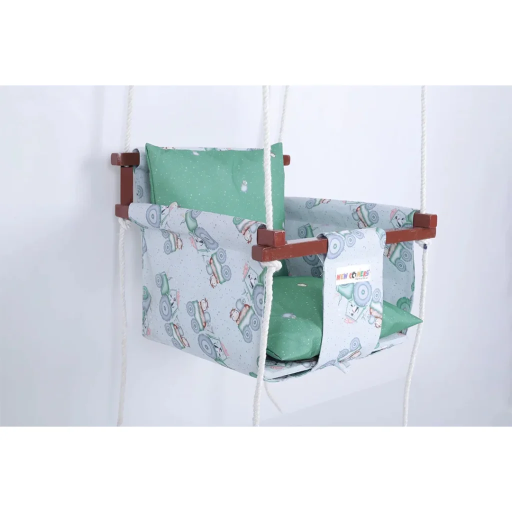 grey tractor print best baby swing bucket jhula with light green pillows for utmost comfort hanging with ropes through wooden frame