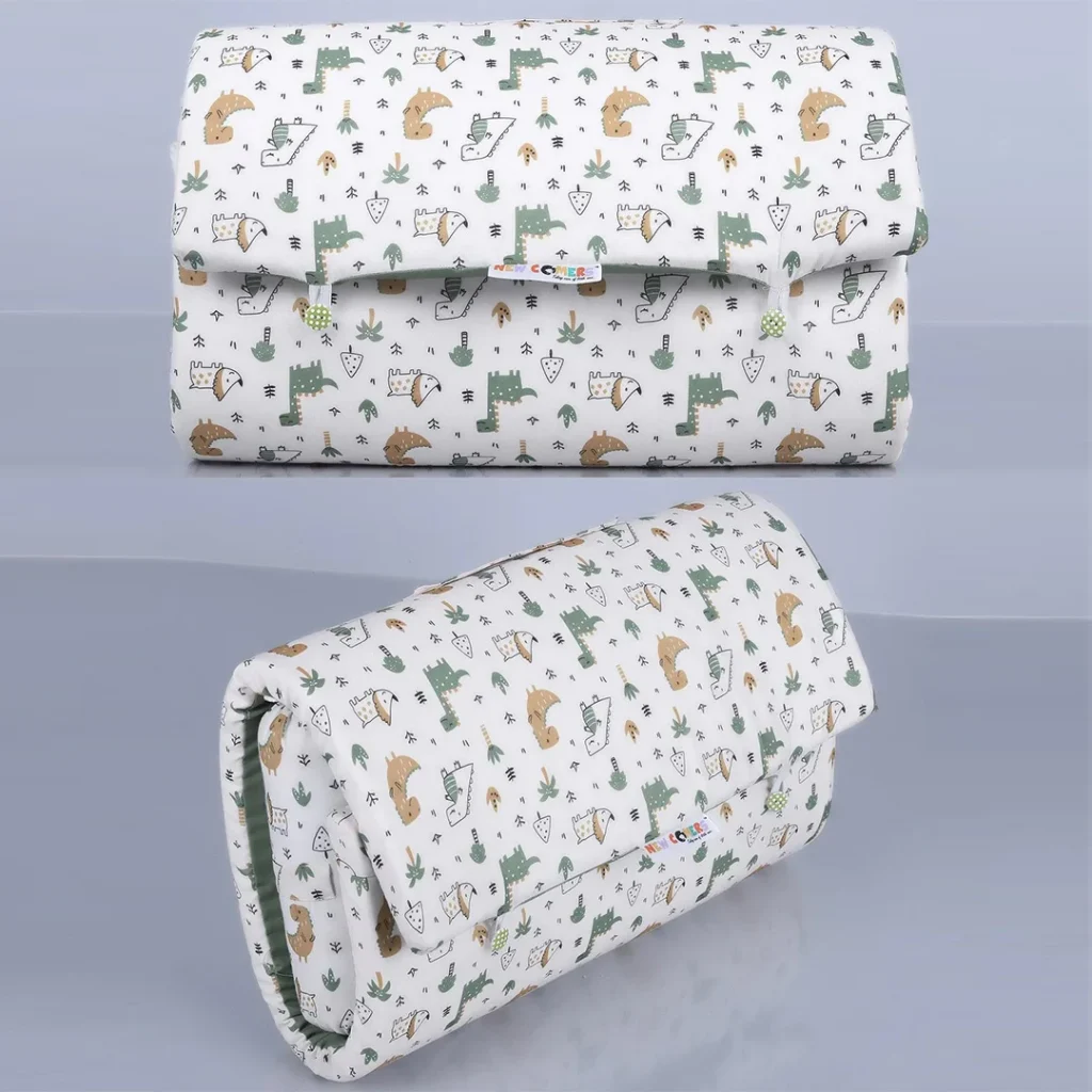 Folded baby bed in a bag, White green dinosaur cartoon print cotton crib bedding set. Solid crib bedding set comes with bed mattress, a pillow and bolster made by newcomers