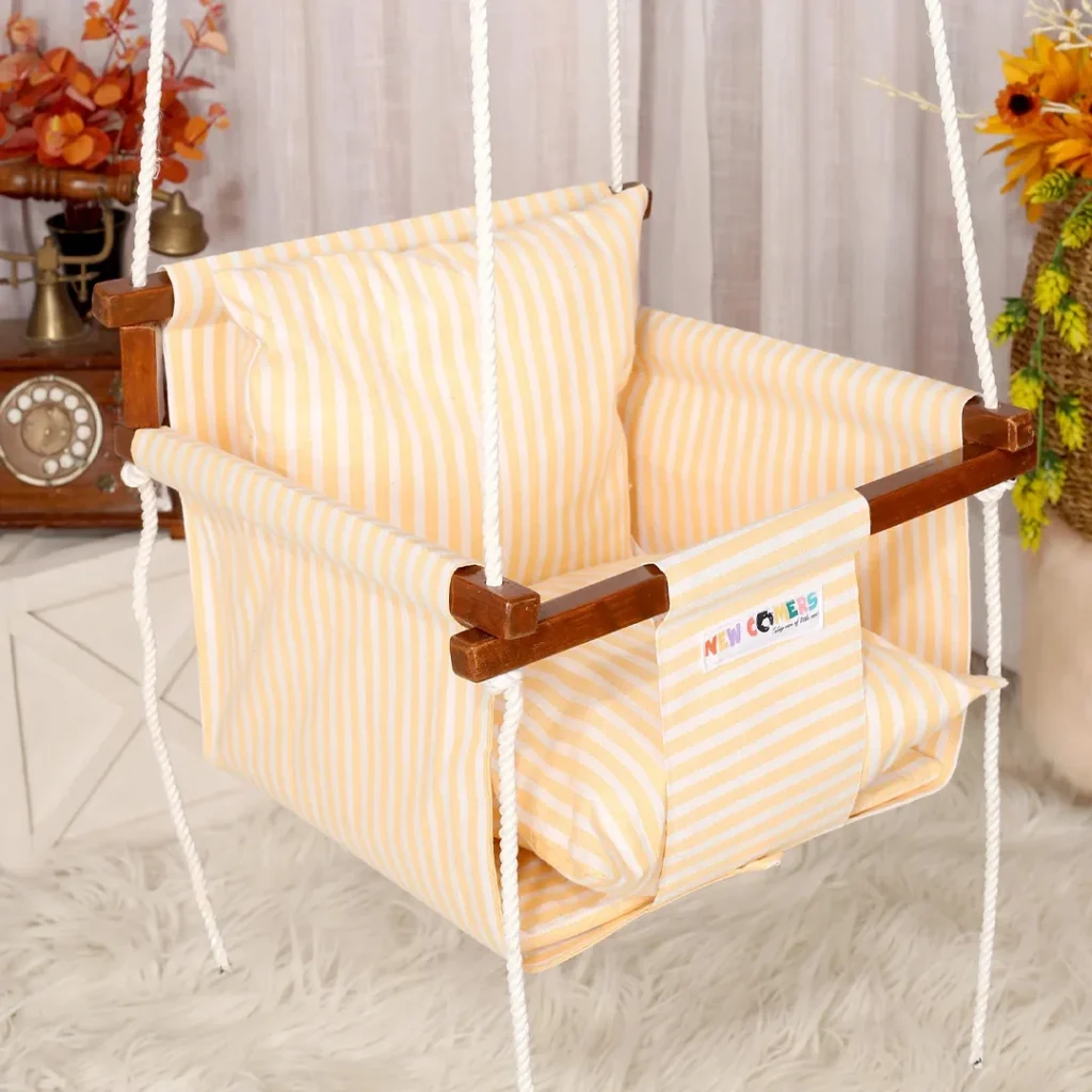 Yellow fabric with white strips print baby jhula swing for small spaces comes with wooden frames and 2 pillows of same design of newcomers brand