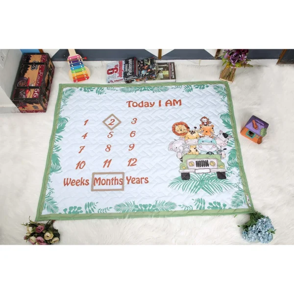 green white organic cotton crib quilt with cartoon prints milestone blanket by newcomers