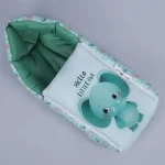 Green colored cartoon cute small elephant saying "Hello Little One" print infant nest for super comfy sleep - newborn sleep pod by newcomers