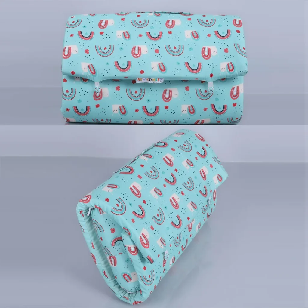 Blue fabric Folded baby bed in a bag with strap to hold it by newcomers